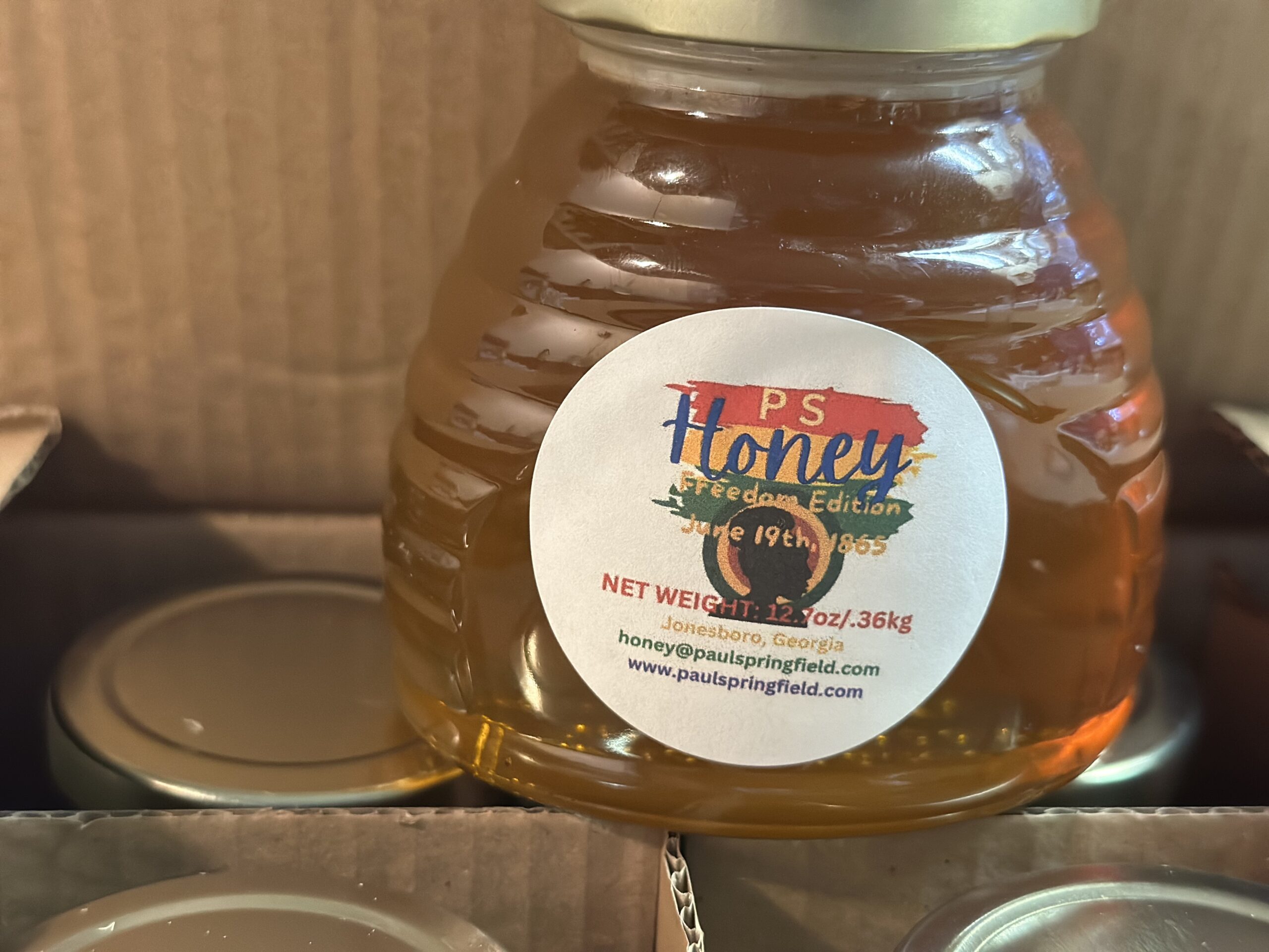 Goodbye gifts on the infusion-center counter: doughnut box, honey jars, mushroom coffee