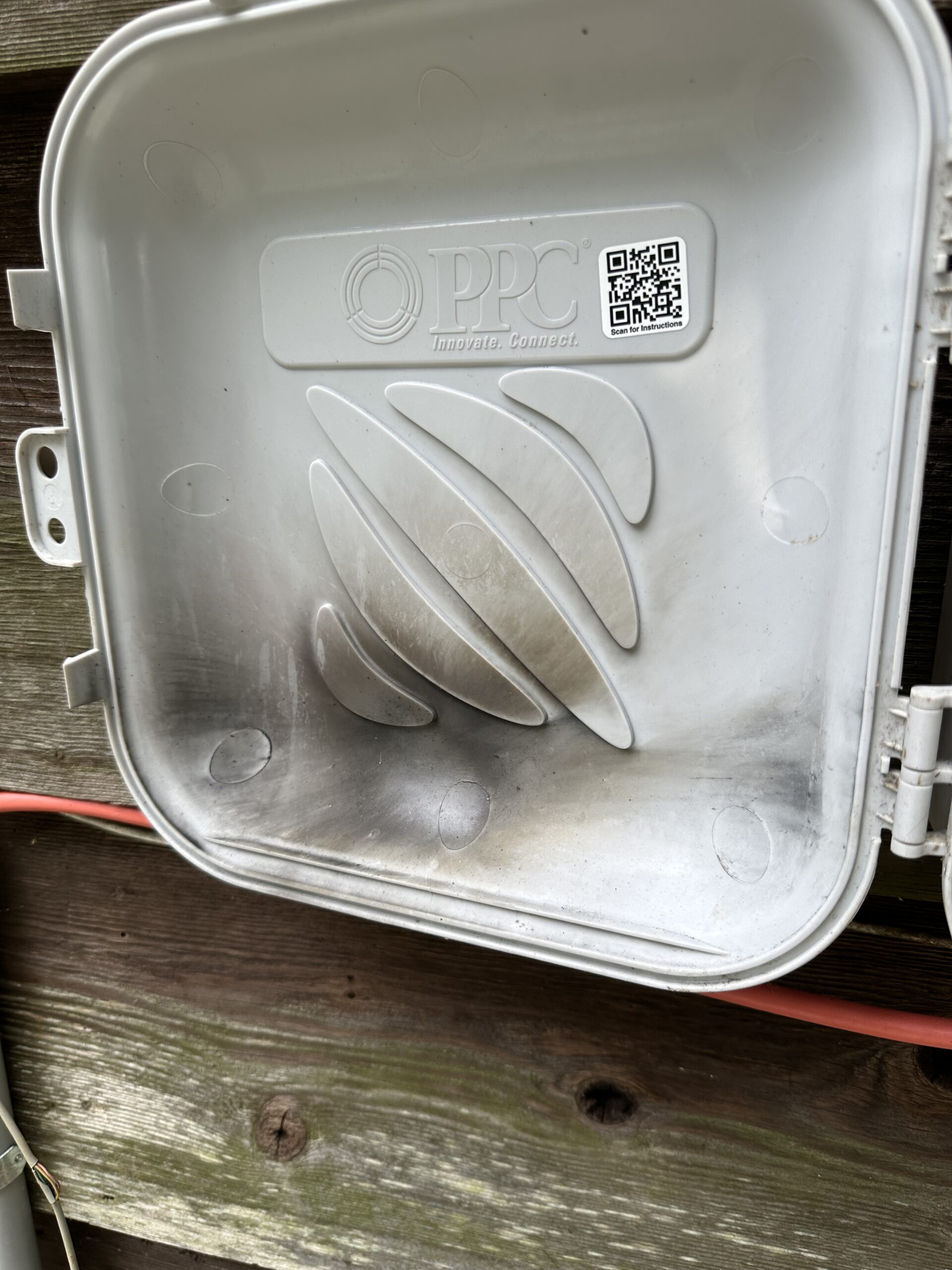 Scorched electrical box on the house from the storm damage