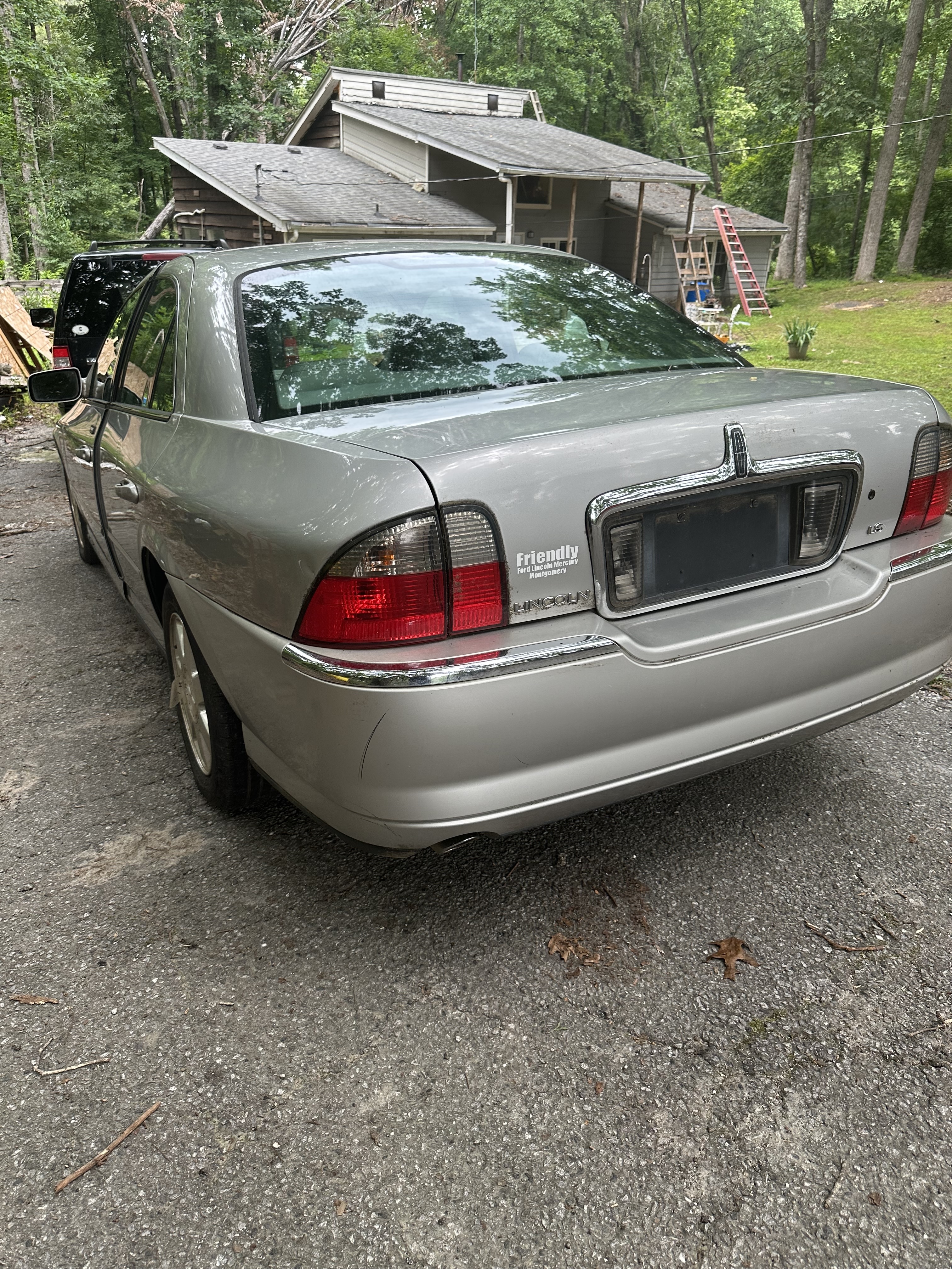 Sally post-wash — rear view in the drive.